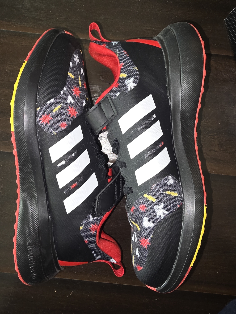 adidas Kids Black Sneakers with White Stripes and Red & Yellow Accents